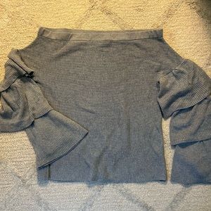 Grey off the shoulder sweater with ruffle bell sleeves.
